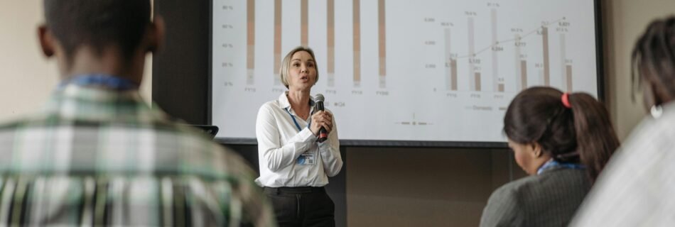 Professional presentation on revenue split by quarter and geography during a business conference.